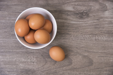 egg on wooden table, Top view and copy space for product display montage.