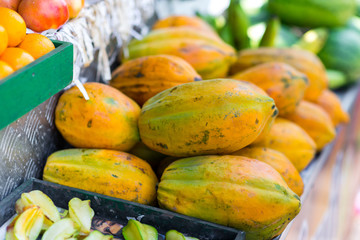 box of papayas on market