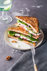 Sandwiches with cream cheese, ham and spinach.