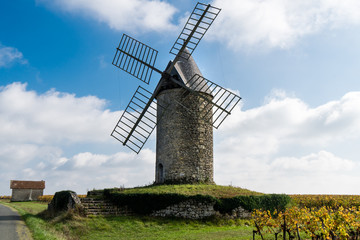 old windmill in a vineyard near Saint-Emilion in Medoc region near Bordeaux France