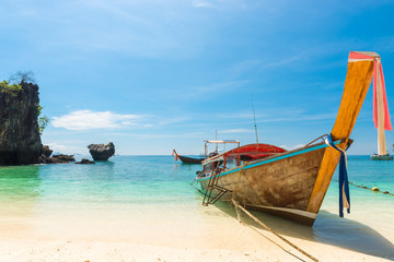 Fototapeta na wymiar wooden Thai boat in the Andaman Sea off the coast of the island