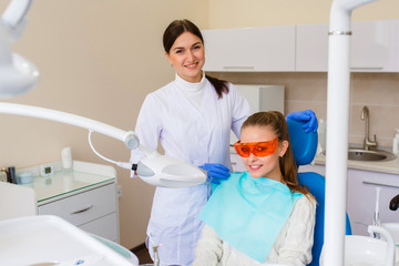 Beautiful girl smiling at the dentist.