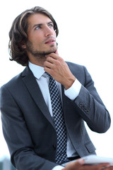 modern businessman with tablet looking at copy space