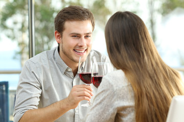 Couple dating drinking wine in a restaurant