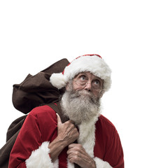 Santa Claus carrying Christmas gifts
