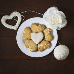 Biscuits in the form of hearts, rose and heart handmade. Flat lay