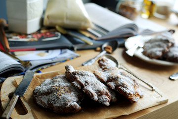 Almond croissants on a tray in a kitchen
