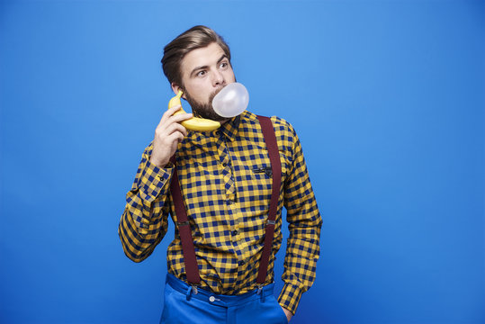 Man using banana as a phone