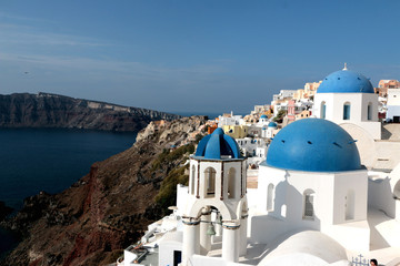 Blurred image of the famous 3 Blue Domes at Santorini