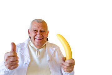 doctor holding banana as impotence concept