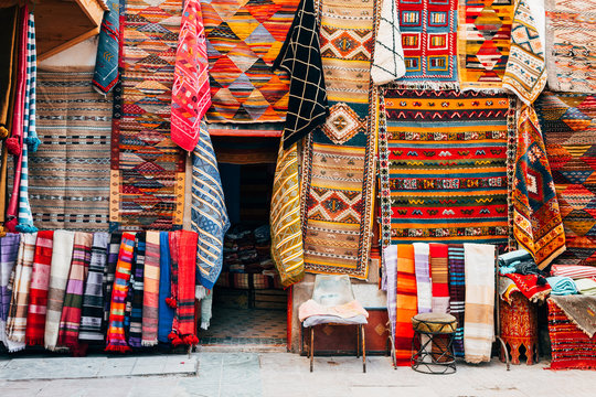 colorful carpets hanging at moroccan shops, marrakech