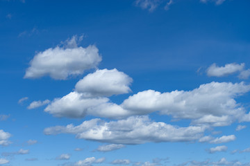 Naklejka na ściany i meble Beautiful blue sky with white fluffy clouds, texture. Nature weather background