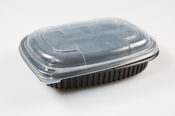 Black plastic container for dairy foods. Isolated on a white