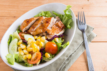 Grilled chicken fillet with colorful salad