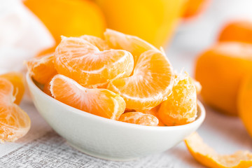 Naklejka na ściany i meble Fresh peeled mandarins, tangerines