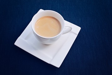 Freshly made coffee in a small white cup