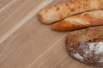 Bread on a wooden background with space for text