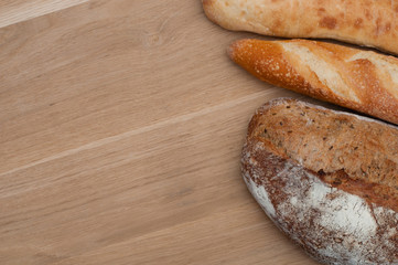 Bread on a wooden background with space for text