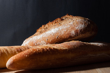 French bread on a black background