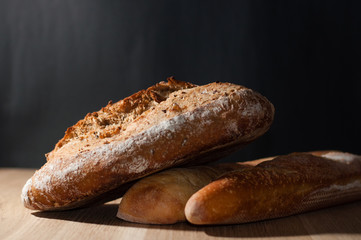French bread on a black background