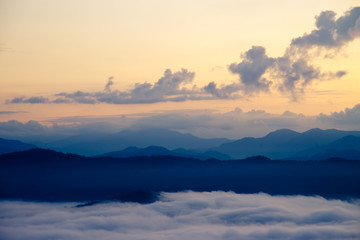 Beautiful Sea of mist in the morning with layer of mountain and sunrise