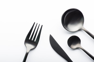 Cutlery set with black fork, knife and spoon