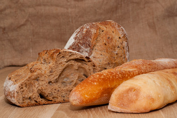 Sliced bread on a wooden board background