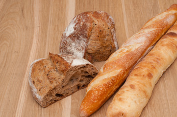 Sliced bread and two baguettes
