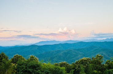 Green layer of forest mountain in the evening for Doi Pha Chu in Thailand