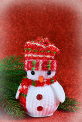 Cheerful snowman on a red background. New Year photo background.