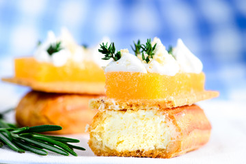 Traditional French dessert. Delicious eclair dessert with cream on tablecloth, selective focus on...