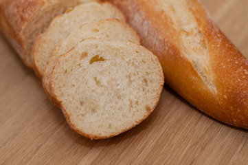 French loaf on a wooden board with space for text