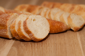 French loaf and ciabatta on a wooden board with space for text