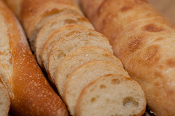 French loaf and ciabatta on a wooden board with space for text