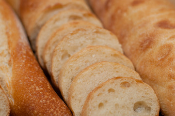 French loaf and ciabatta on a wooden board with space for text