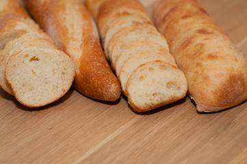 French loaf and ciabatta on a wooden board with space for text