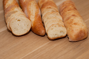 French loaf and ciabatta on a wooden board with space for text
