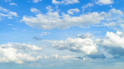 Naklejka na ściany i meble Beautiful blue sky with white fluffy clouds, texture. Nature weather background