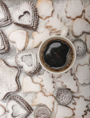 Close up view of freshly baked new year cookies and hot coffee , selective focus , top view