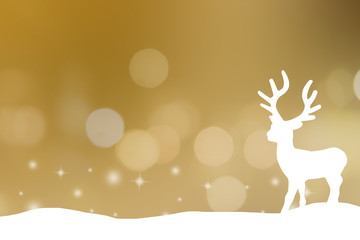 Obraz premium white silhouette reindeer standing on snow floor isolated on golden background with bokeh and twinkle star light effect for Christmas celebration concept