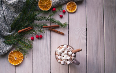 Christmas cocoa with marshmallows on white wooden table