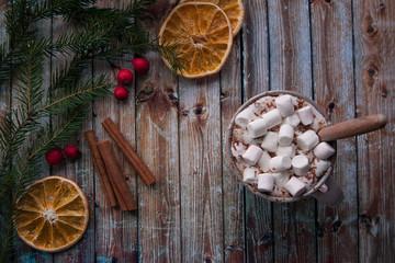 Christmas cocoa with marshmallows on white wooden table