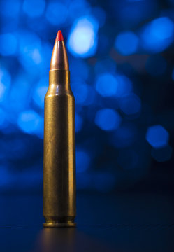 Rifle ammo with blue behind