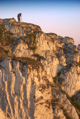 Photographer on a cliff with a camera