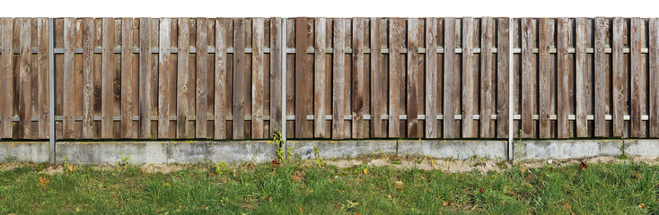 Long old solid aged   brown  wooden rural fence from vertical pine planks.