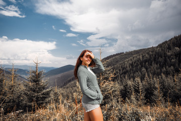 Outdoor close up portrait stylish hipster girl behind amazing mountains landscapes,sexy girl hiking,female in a mountains, girl in casual wear, tan, attractive, success, happy girl, emotional portrait