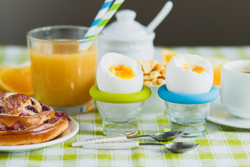 Soft boiled chicken egg, coffee, baking, muesli and orange juice