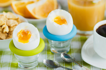 Soft boiled chicken egg, coffee, muesli and orange juice