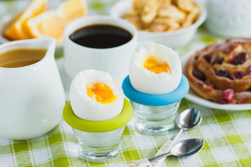 Soft boiled chicken egg, coffee, baking, muesli and orange juice