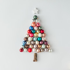 Christmas tree made of bauble decoration. Minimal New year concept.